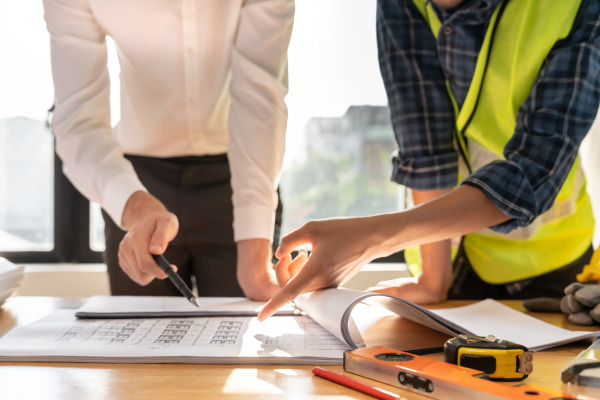 inspector engineer and owner project is inspecting construction and quality assurance new house. Engineers or architects or contactor work to build the house before handing it over to the homeowner